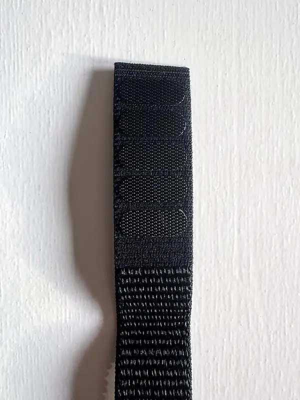 Close-up of the hook-and-loop (velcro) side of the nylon Garmin watch strap