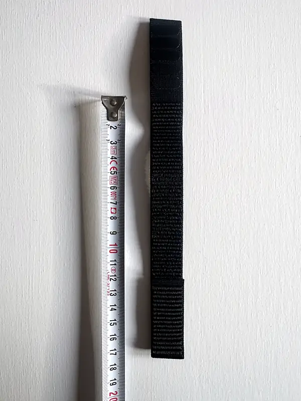 Nylon hook-and-loop Garmin watch strap next to a tape measure β 17.5 cm usable length